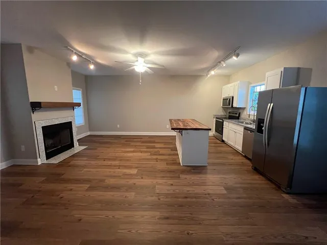 a view of kitchen with furniture and a fireplace