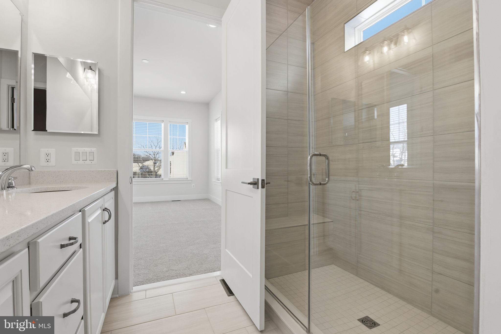 124 Bridge Valley Road Gettysburg, PA 17325 - Photo 19 of 34 a bathroom with a shower sink and mirror