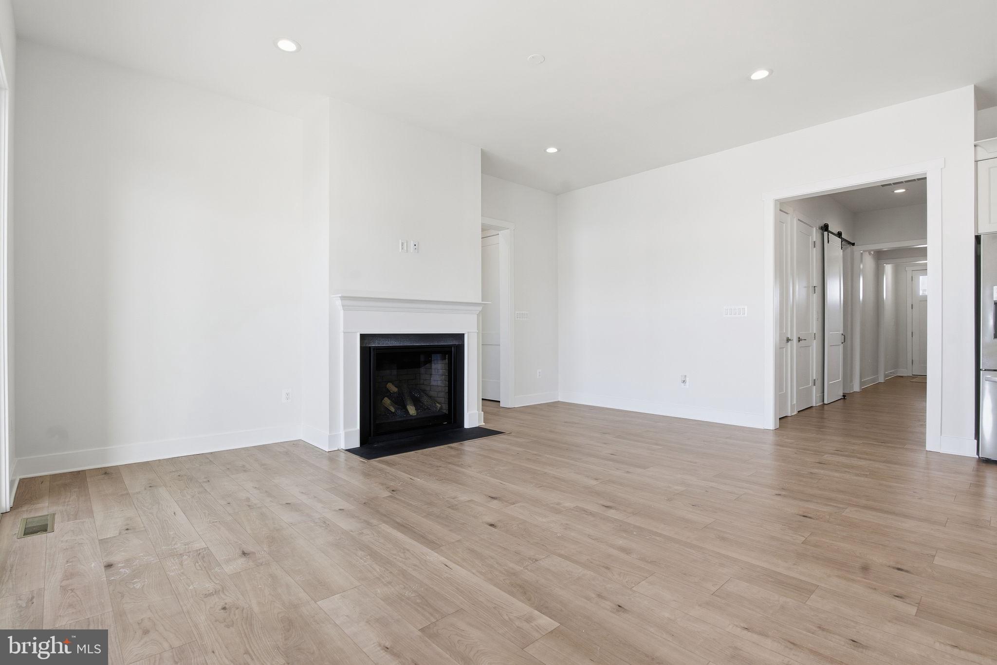 124 Bridge Valley Road Gettysburg, PA 17325 - Photo 7 of 34 a view of empty room with wooden floor and fireplace