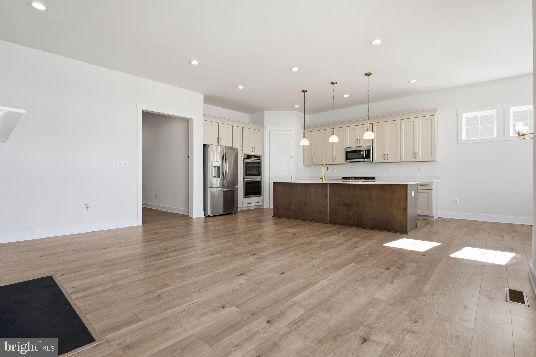 124 Bridge Valley Road Gettysburg, PA 17325 - Photo 10 of 34 a view of kitchen with refrigerator stove and wooden floor