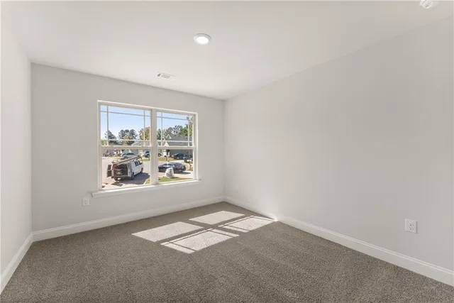 an empty room with closet area