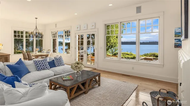 a bedroom with bed couch and window