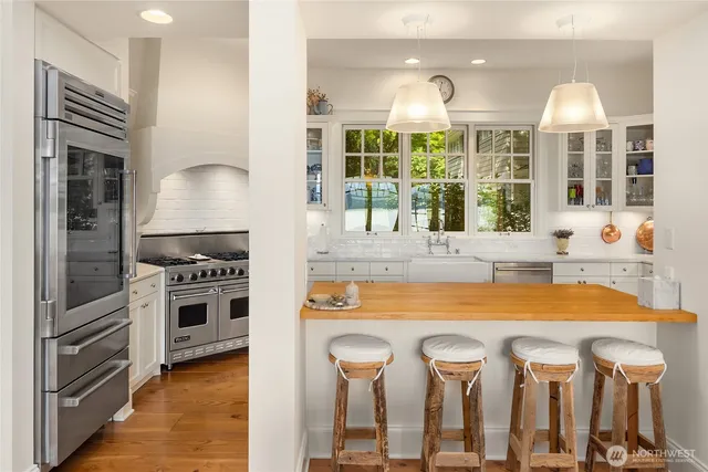 a living room with furniture pool table and a table