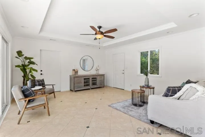 13311 Fallen Leaf Road Poway, CA 92064 - Photo 16 of 30 a living room with furniture a window and a potted plant
