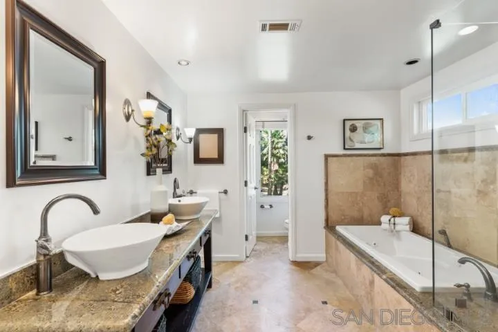 13311 Fallen Leaf Road Poway, CA 92064 - Photo 20 of 30 a bathroom with a granite countertop tub sink and mirror