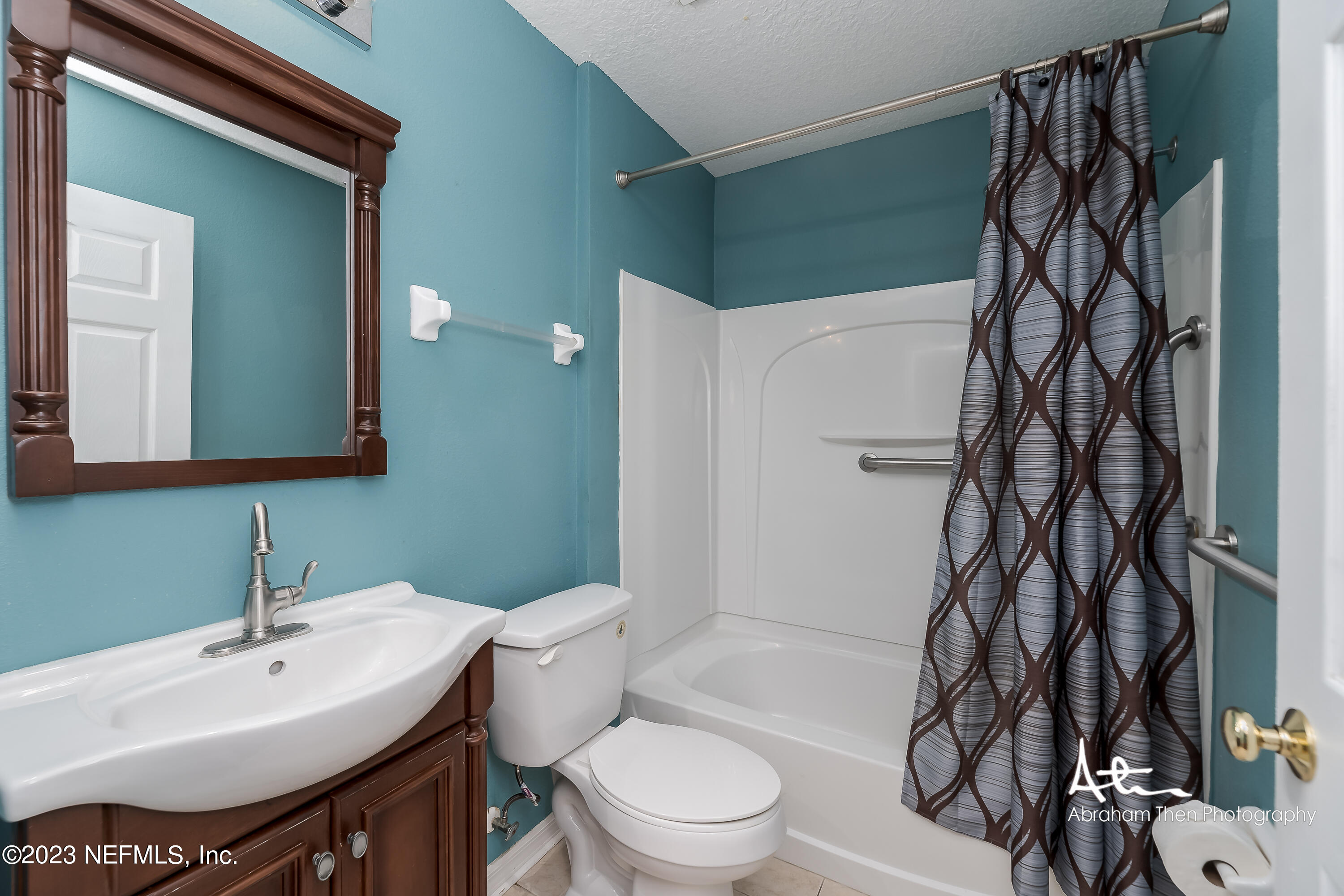 742 Ginger Mill Drive St. Johns, FL 32259 - Photo 17 of 32 a bathroom with a sink toilet and shower