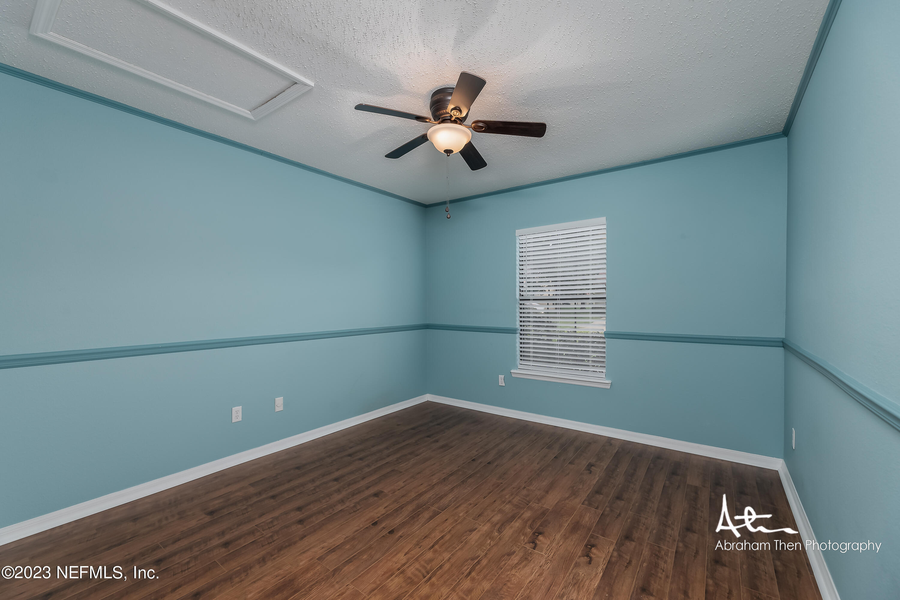742 Ginger Mill Drive St. Johns, FL 32259 - Photo 18 of 32 wooden floor in an empty room with a window
