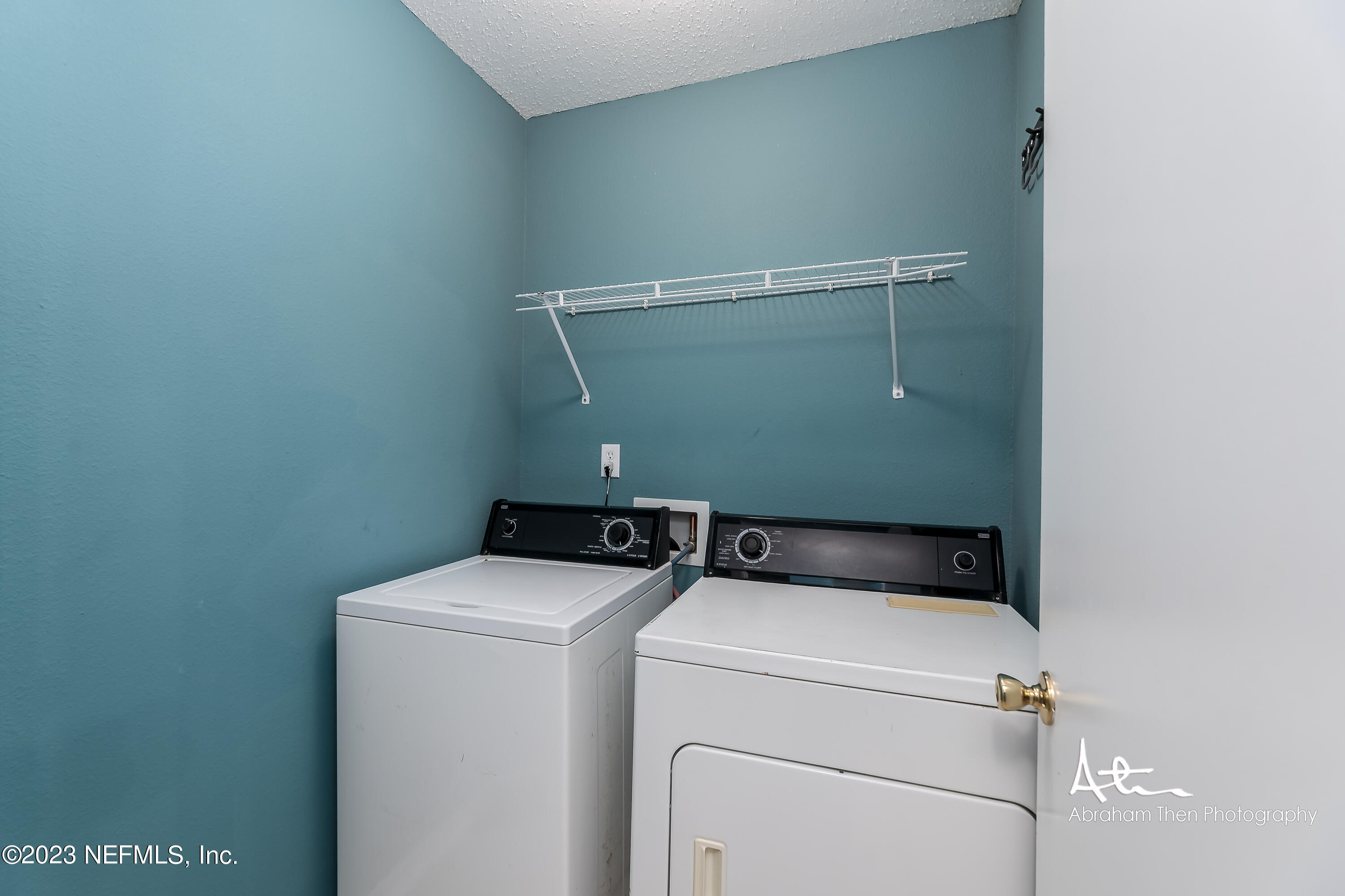 742 Ginger Mill Drive St. Johns, FL 32259 - Photo 19 of 32 a utility room with dryer and washer