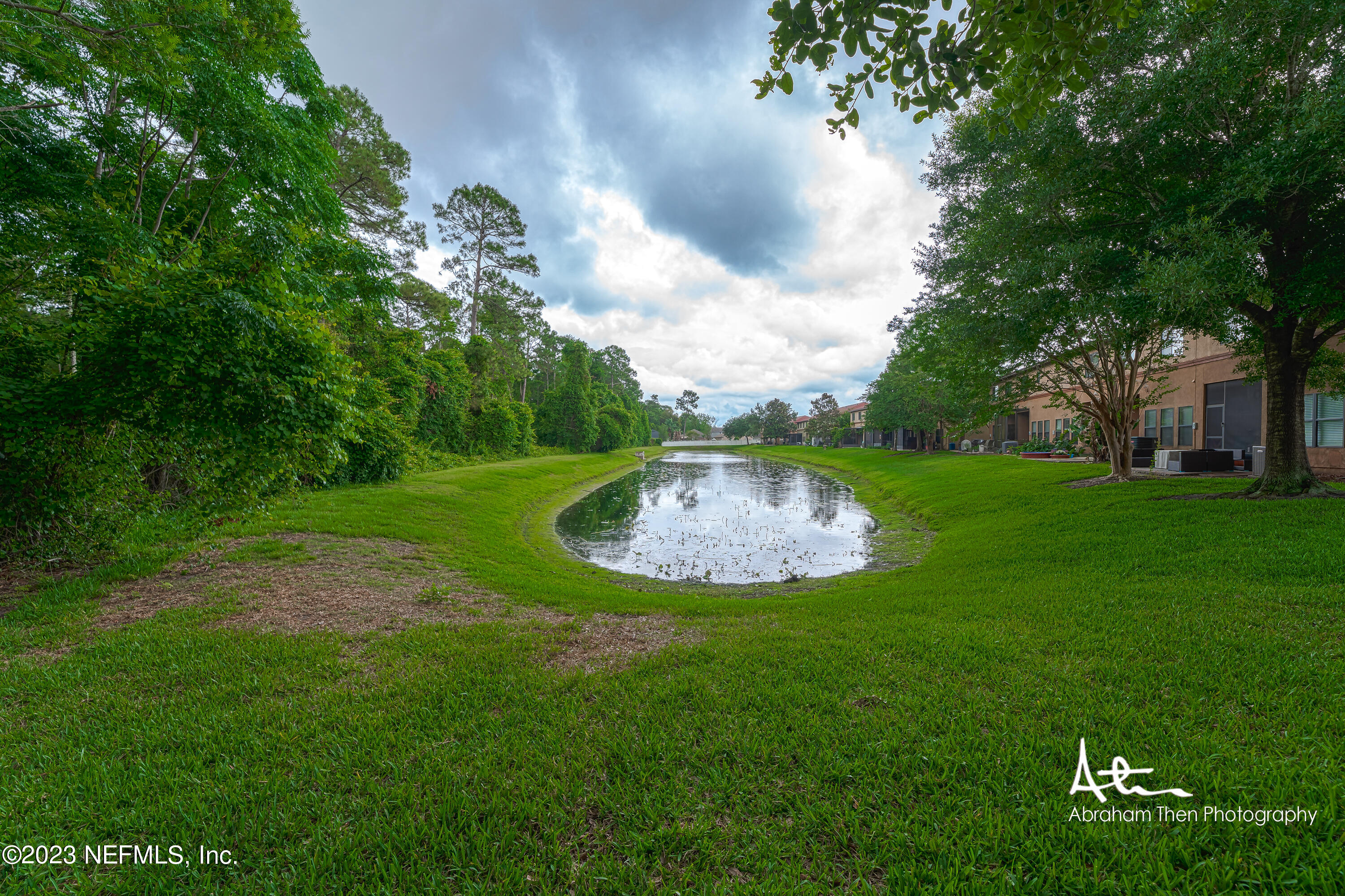 742 Ginger Mill Drive St. Johns, FL 32259 - Photo 23 of 32 a view of a fountain in front of a house with big yard