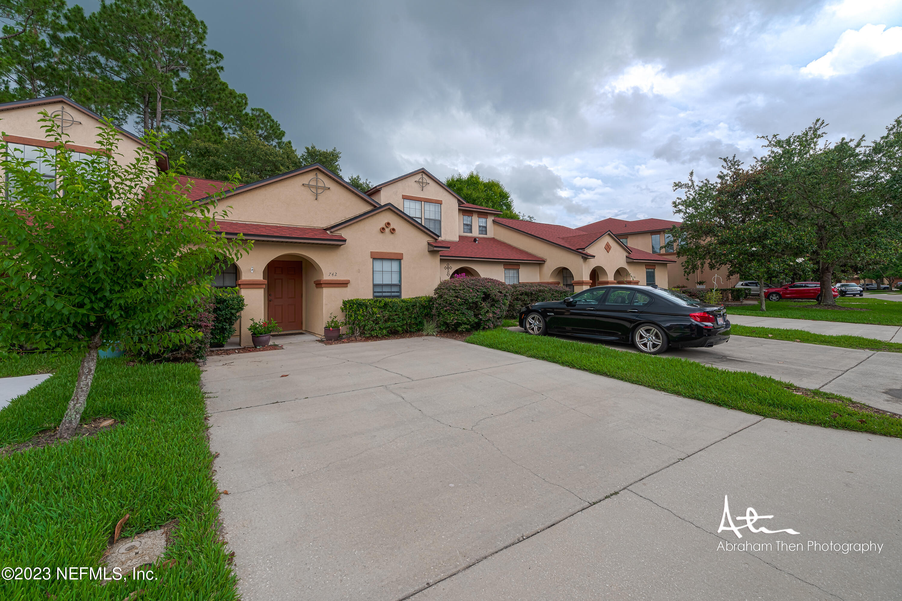 742 Ginger Mill Drive St. Johns, FL 32259 - Photo 3 of 32 a front view of a house with garden