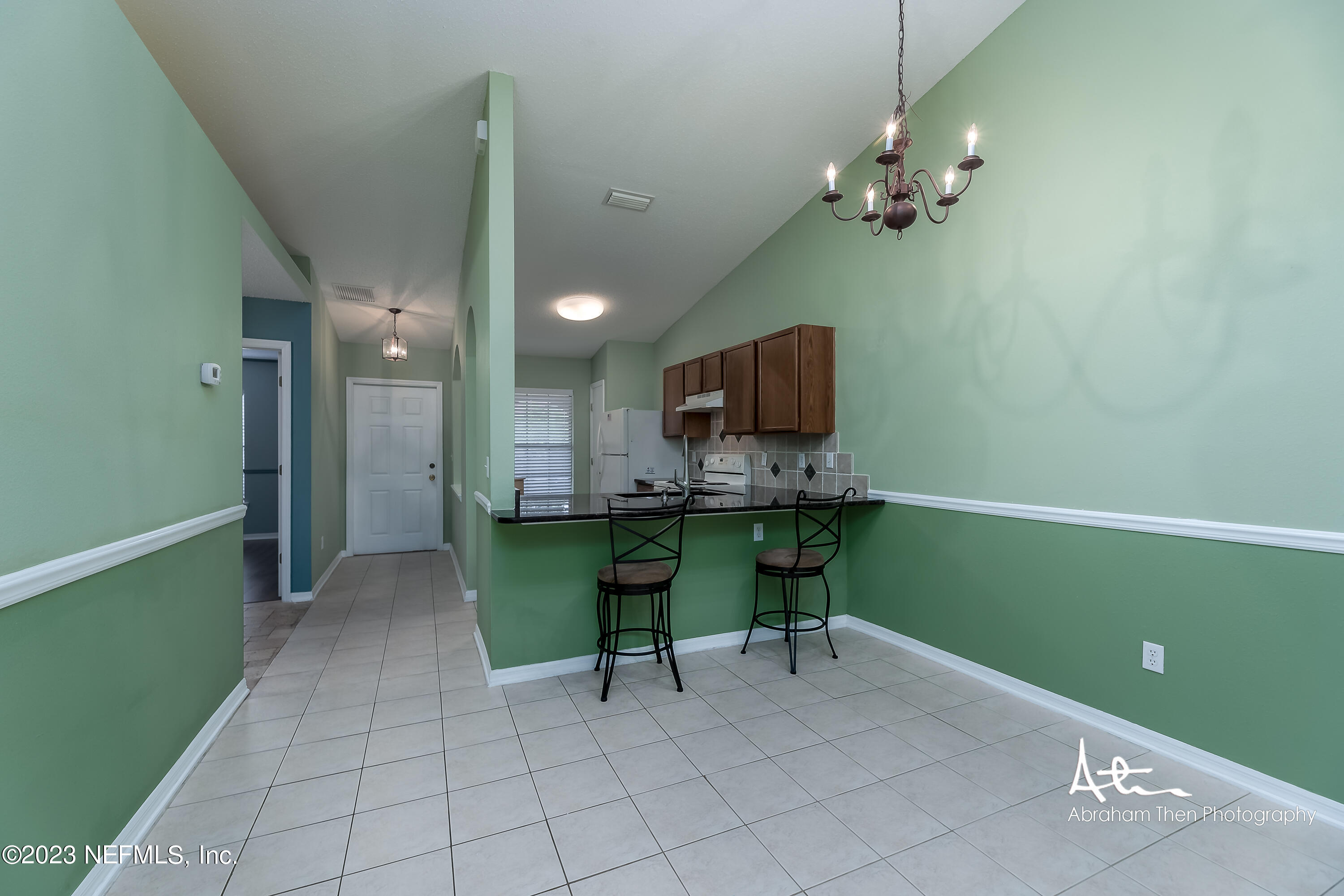 742 Ginger Mill Drive St. Johns, FL 32259 - Photo 4 of 32 a view of kitchen with furniture and chandelier