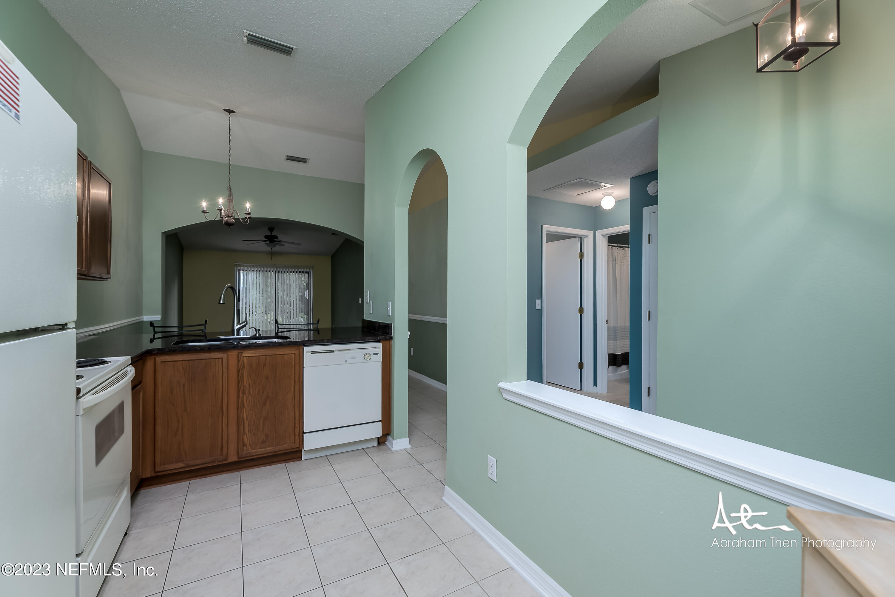 742 Ginger Mill Drive St. Johns, FL 32259 - Photo 5 of 32 a kitchen with stainless steel appliances granite countertop a refrigerator and a stove