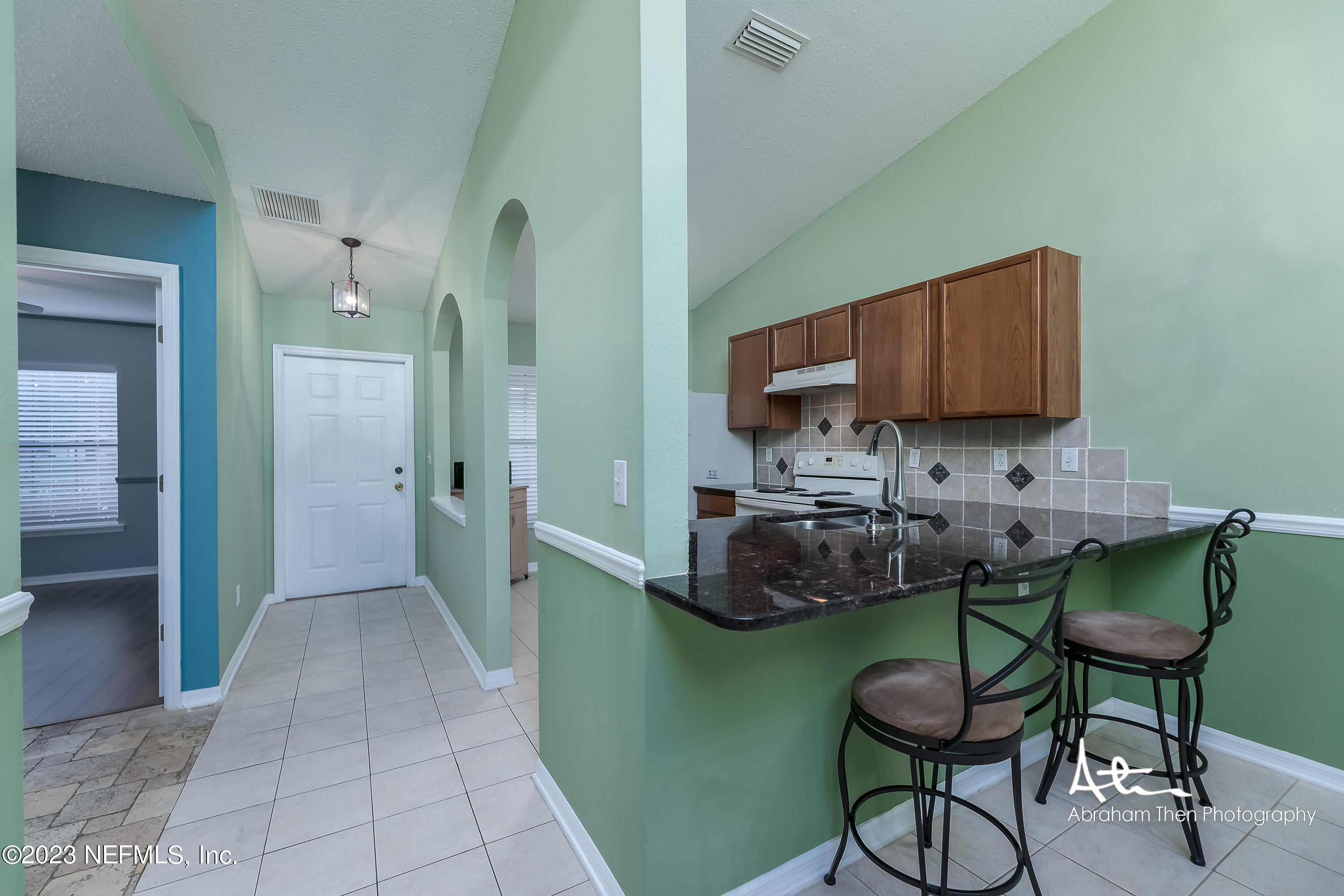 742 Ginger Mill Drive St. Johns, FL 32259 - Photo 8 of 32 a room with a table and chairs