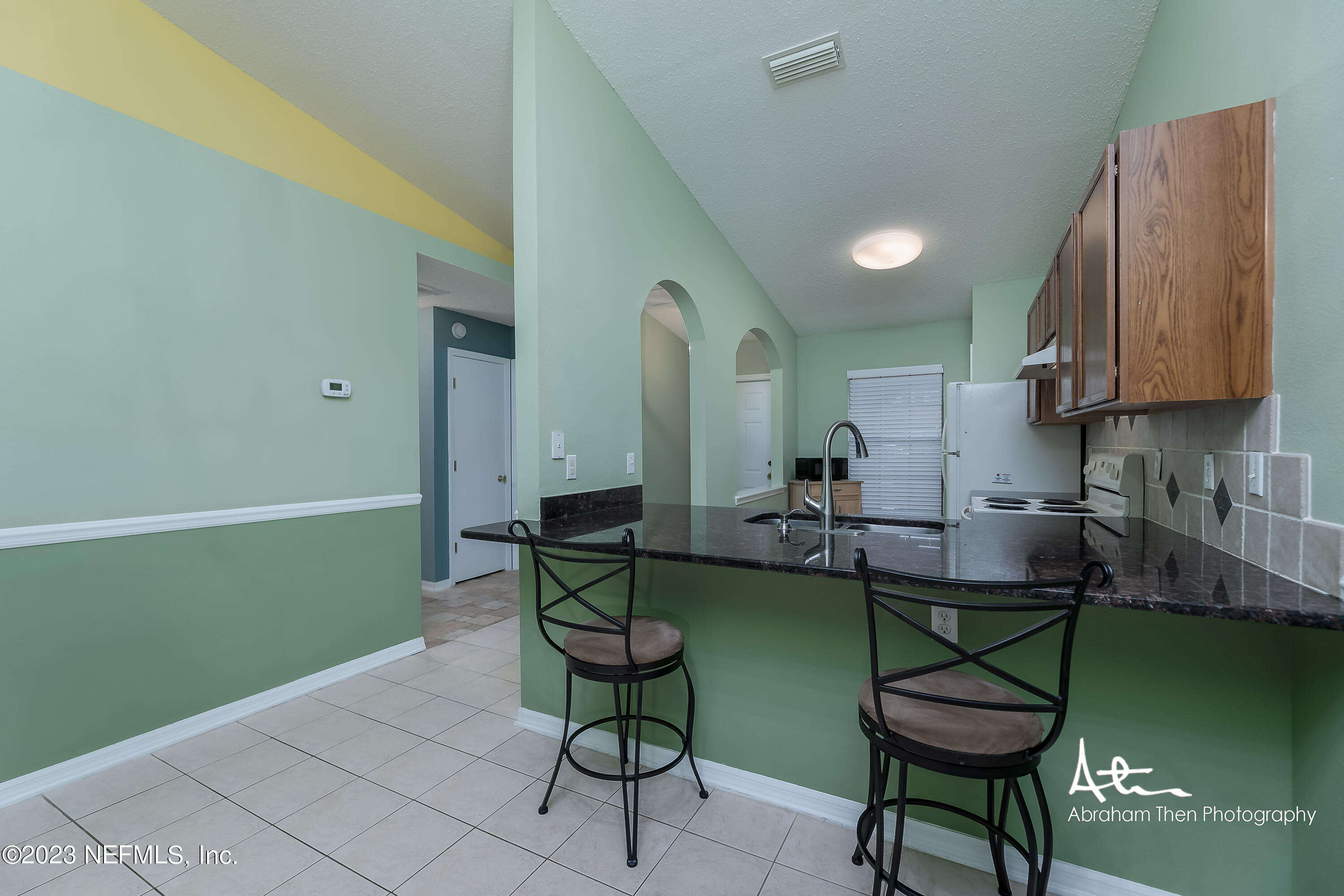 742 Ginger Mill Drive St. Johns, FL 32259 - Photo 9 of 32 a view of a room with chairs and wooden floor