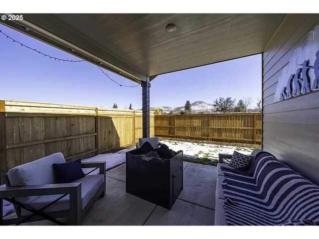 a view of a balcony with chair and table