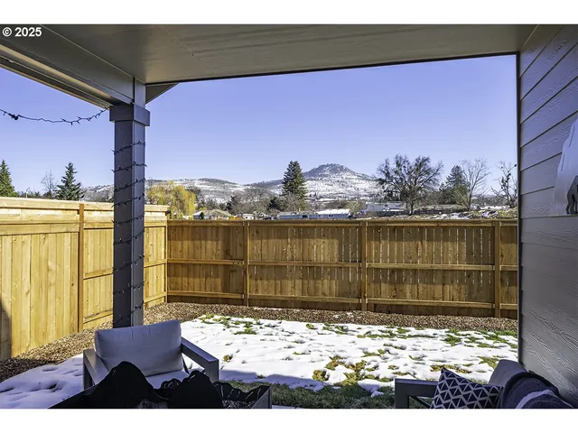 a view of living room with furniture and a rug