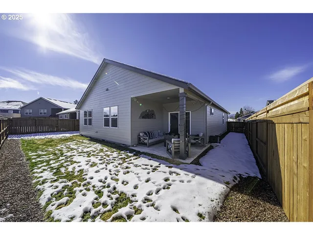 a view of a balcony with two chairs