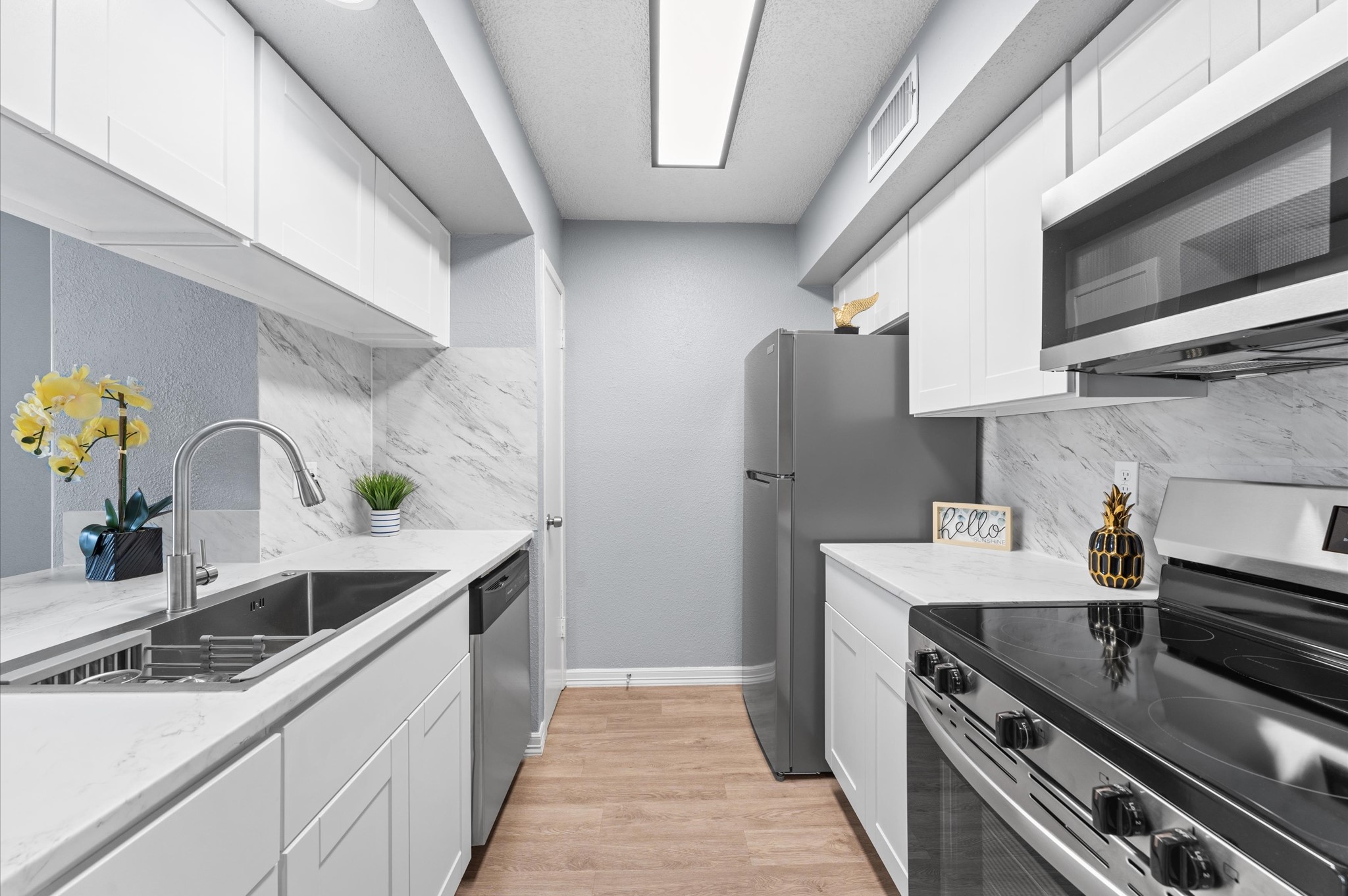 Gorgeous updated kitchen with new cabinetry, appliances and lighting.