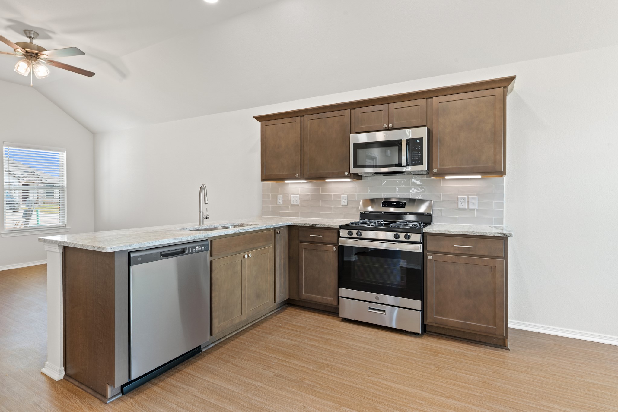 1215 High Street Navasota, TX 77868 - Photo 12 of 23 a kitchen with stainless steel appliances granite countertop a stove and a sink