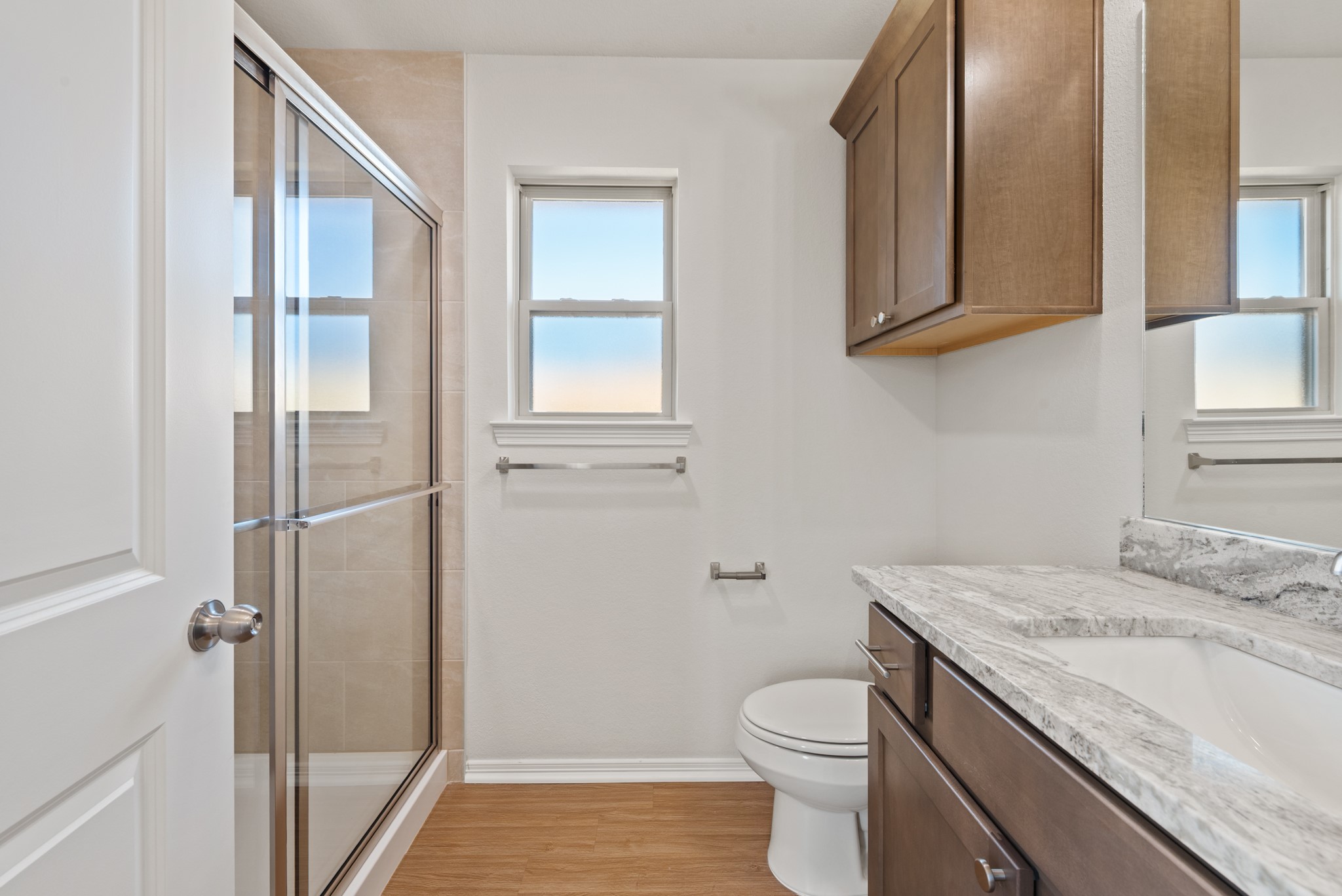 1215 High Street Navasota, TX 77868 - Photo 15 of 23 a bathroom with a granite countertop sink toilet and shower