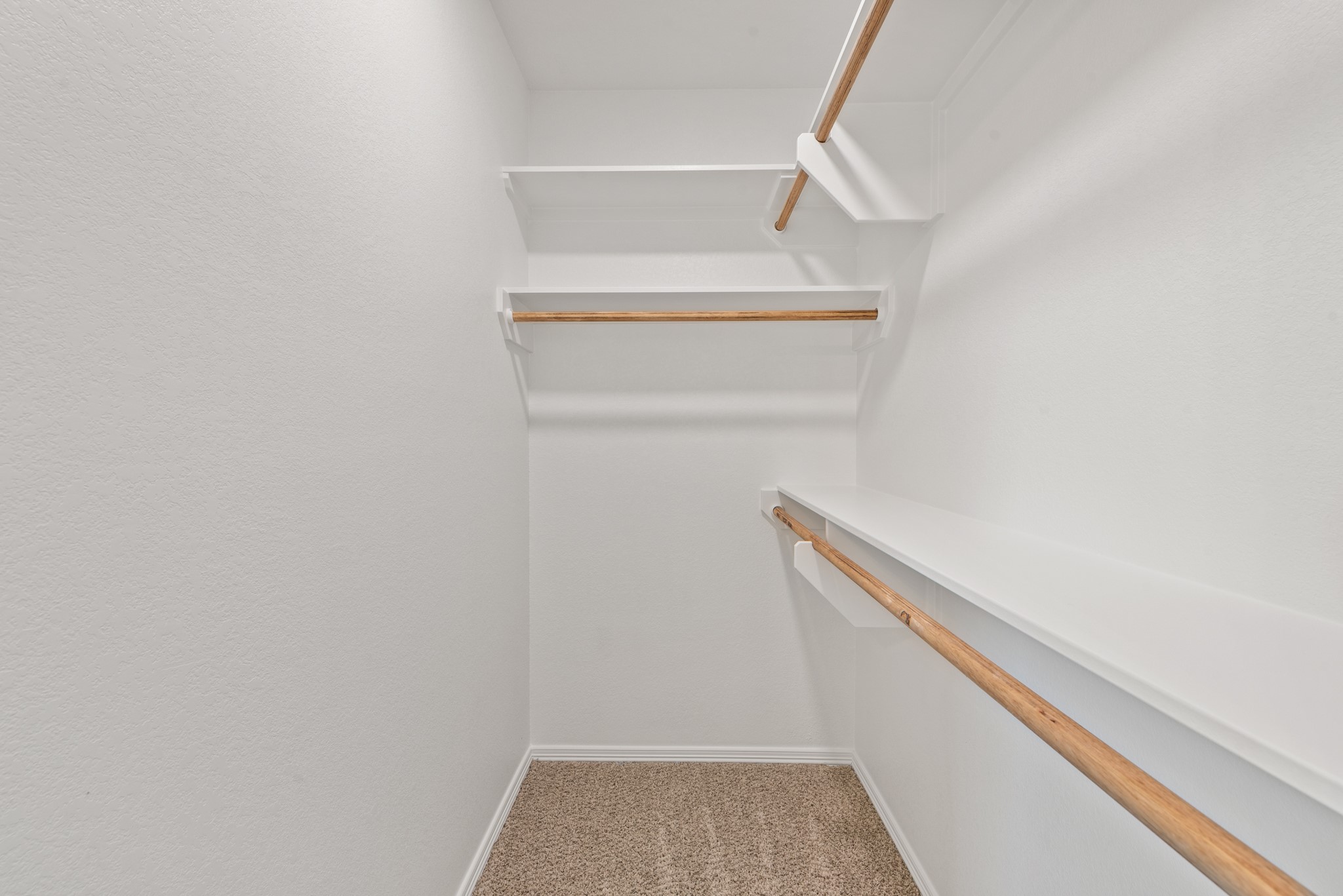 1215 High Street Navasota, TX 77868 - Photo 18 of 23 a view of walk in closet with empty racks