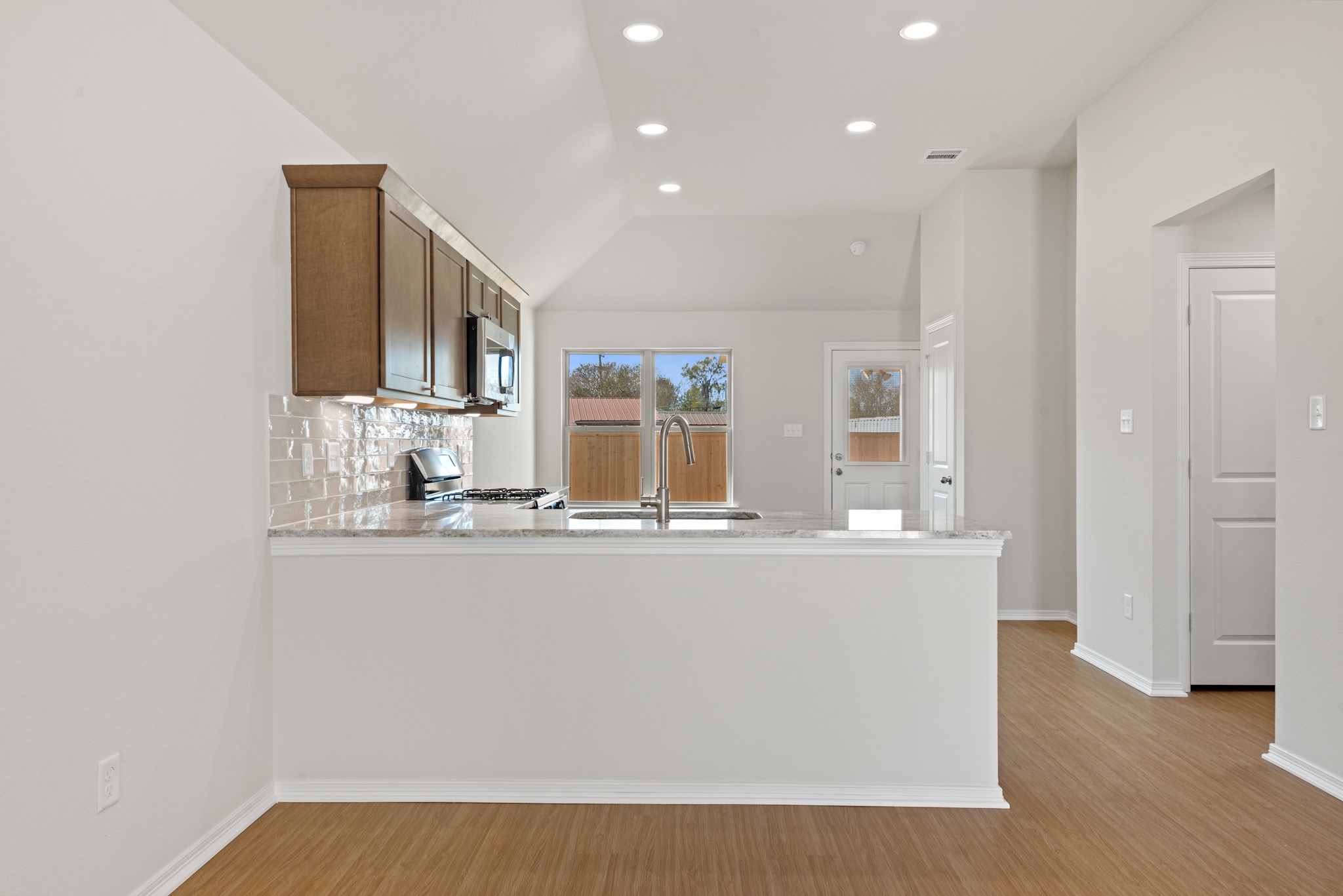 1215 High Street Navasota, TX 77868 - Photo 7 of 23 a view of kitchen with stainless steel appliances granite countertop cabinets and wooden floor
