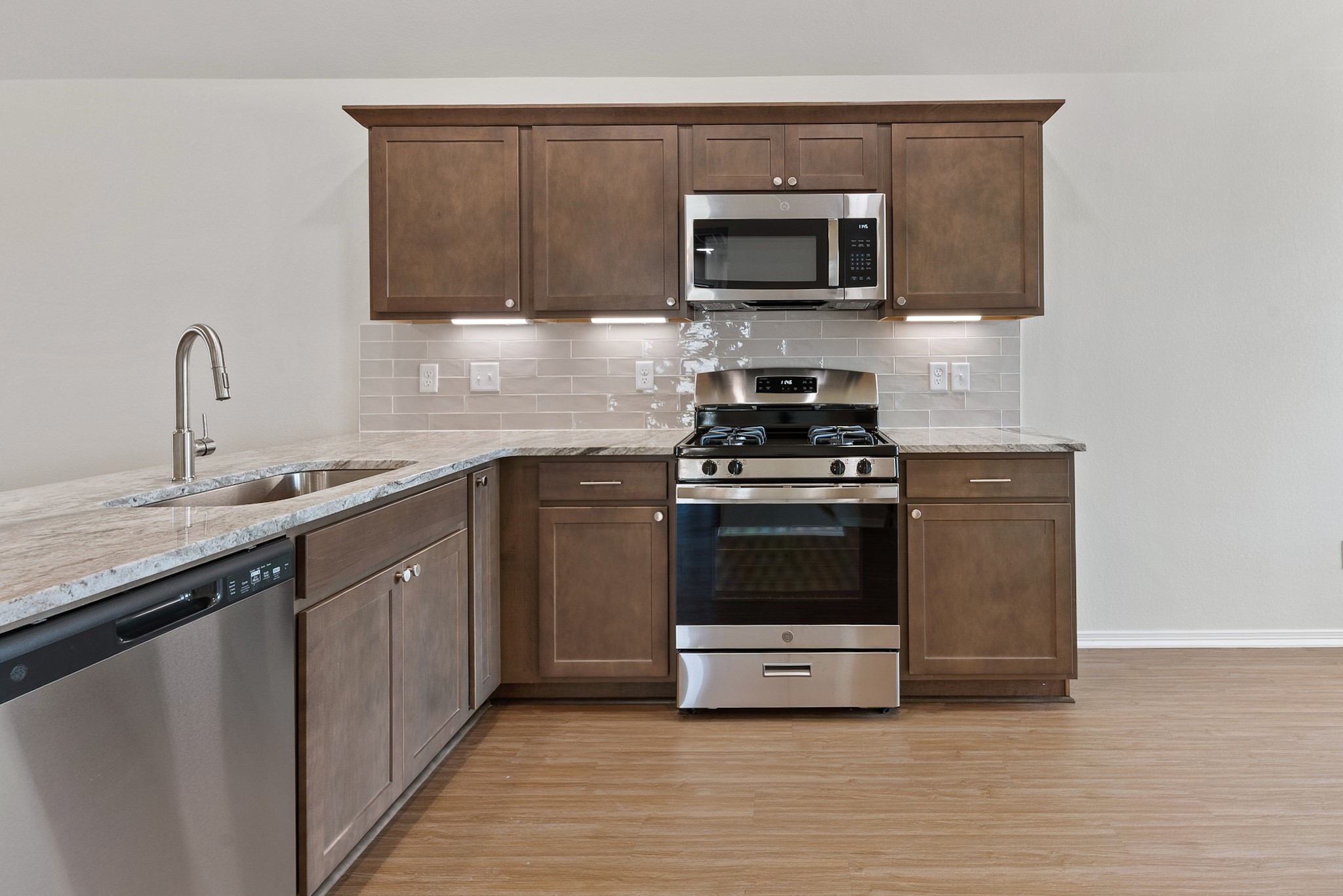 1215 High Street Navasota, TX 77868 - Photo 10 of 23 a kitchen with a sink and steel appliances
