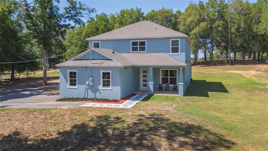35369 Ruffing Road Dade City, FL 33523 - Photo 1 of 63 a front view of a house with a yard