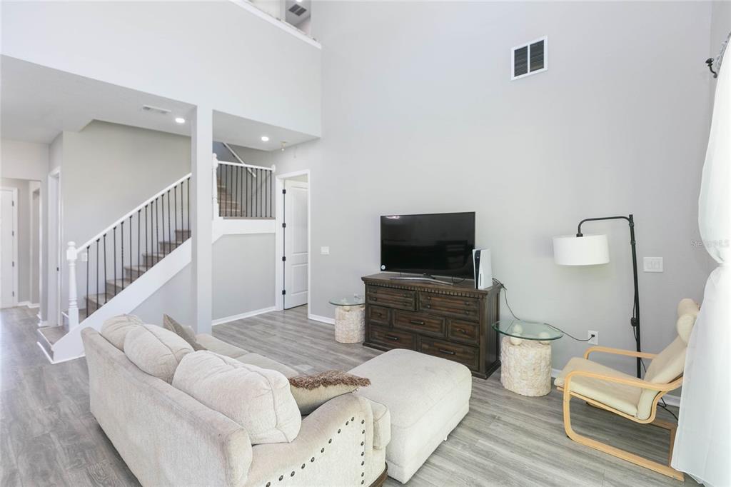 35369 Ruffing Road Dade City, FL 33523 - Photo 14 of 63 a bedroom with furniture and a flat screen tv