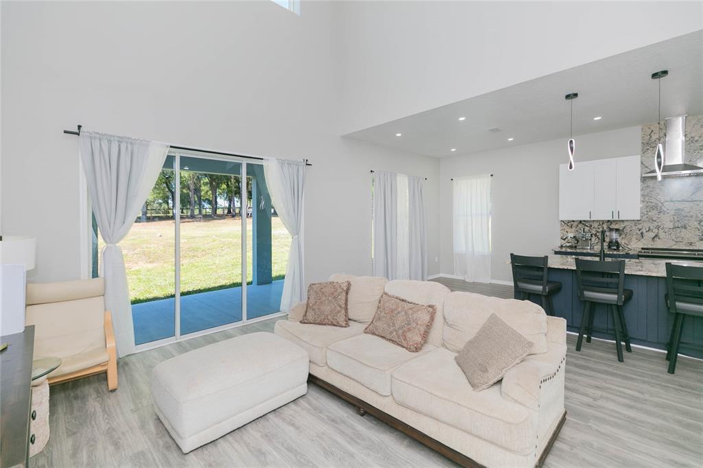 35369 Ruffing Road Dade City, FL 33523 - Photo 16 of 63 a living room with furniture and a large window