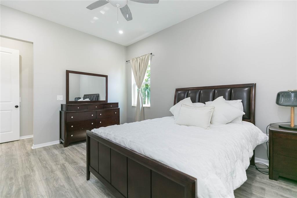 35369 Ruffing Road Dade City, FL 33523 - Photo 19 of 63 a bedroom with a bed and a dresser