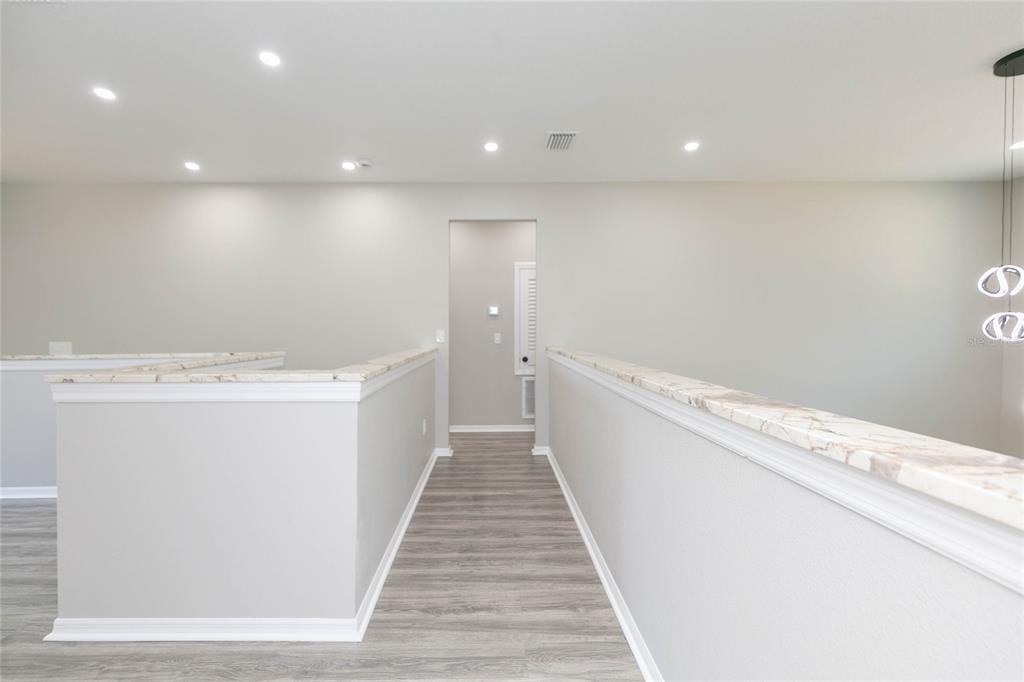 35369 Ruffing Road Dade City, FL 33523 - Photo 26 of 63 a view of a bathroom with a sink and wooden floor