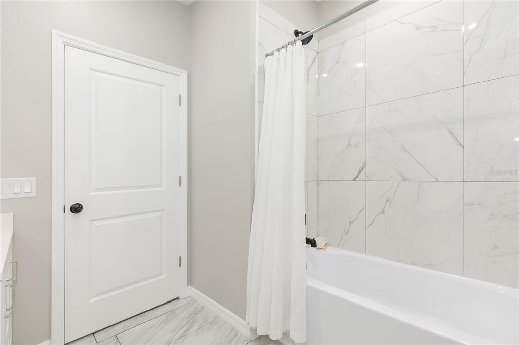 35369 Ruffing Road Dade City, FL 33523 - Photo 31 of 63 a bathroom with a bathtub