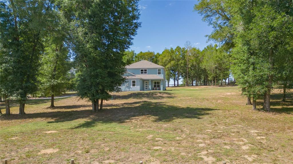35369 Ruffing Road Dade City, FL 33523 - Photo 49 of 63 a front view of a house with a yard