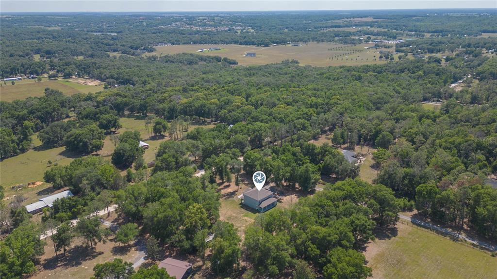 35369 Ruffing Road Dade City, FL 33523 - Photo 55 of 63 an aerial view of a houses with outdoor space and trees