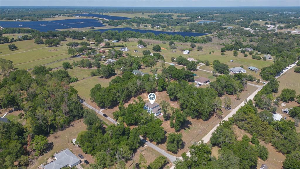35369 Ruffing Road Dade City, FL 33523 - Photo 59 of 63 an aerial view of residential houses with outdoor space and trees
