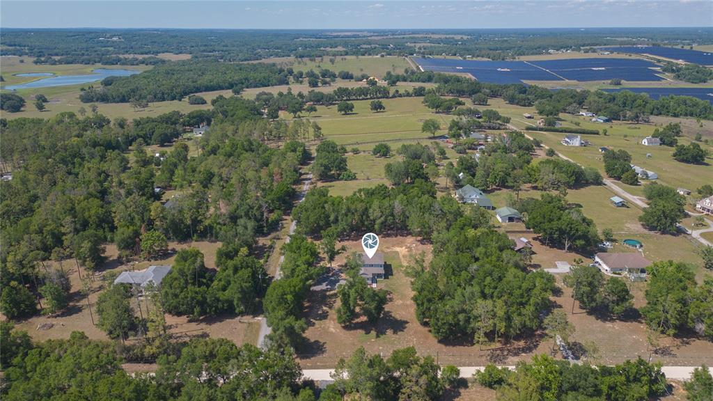 35369 Ruffing Road Dade City, FL 33523 - Photo 60 of 63 an aerial view of residential houses with outdoor space and mountain view