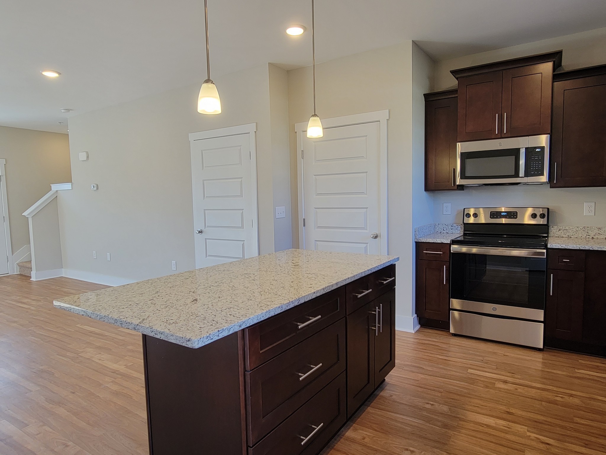 4011 Angelica Ct Spring Hill Spring Hill, TN 37174 - Photo 5 of 15 a kitchen with stainless steel appliances granite countertop a stove a sink and a microwave