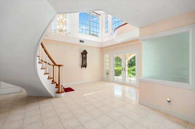 a view of entryway and hall with a window