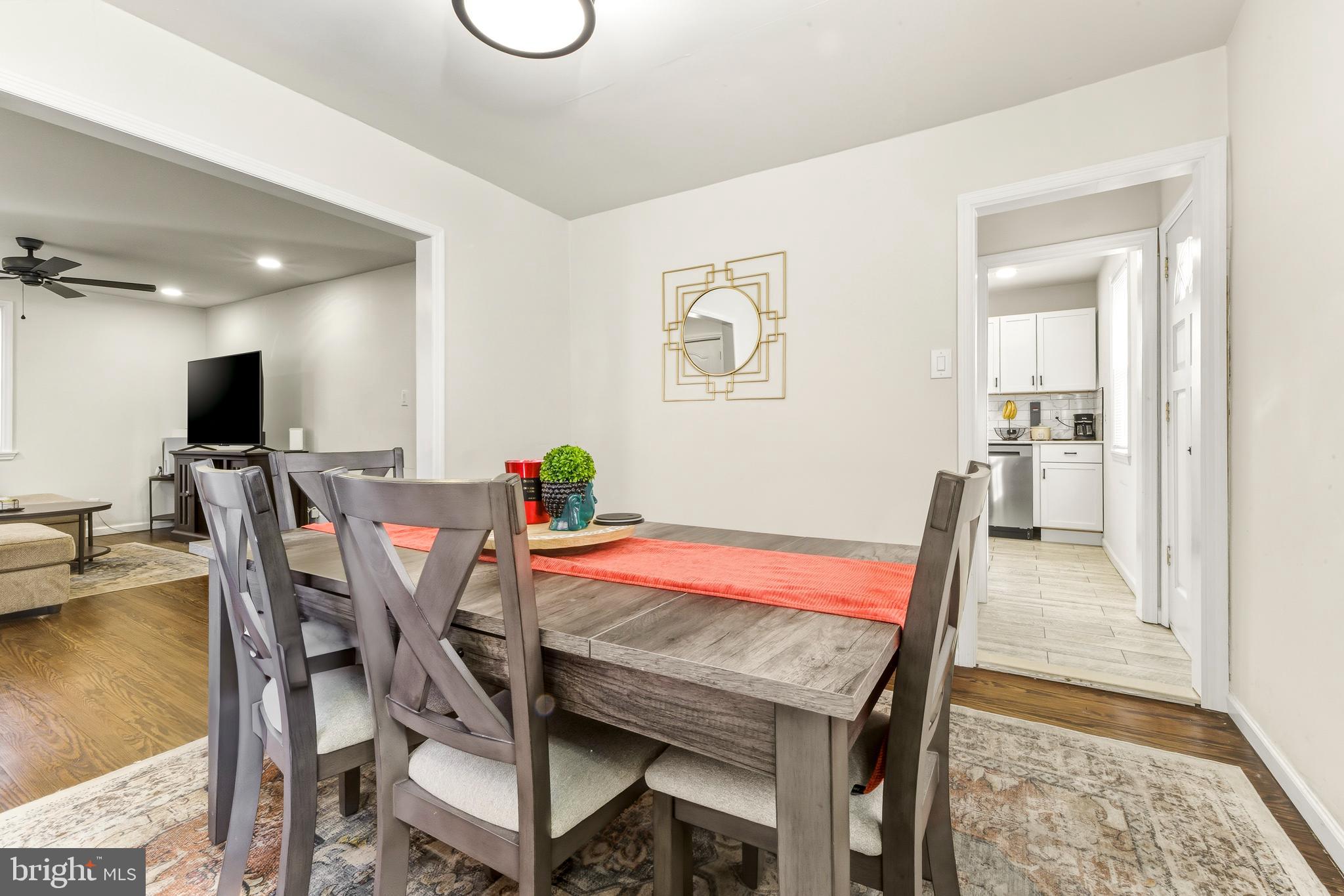 1287 Clements Bridge Road Woodbury, NJ 08096 - Photo 7 of 16 a dining room with furniture and wooden floor