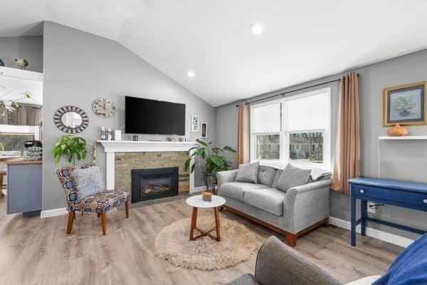16 Hazelwood Road Dennis, MA 02660 - Photo 9 of 40 a living room with furniture a fireplace and a flat screen tv