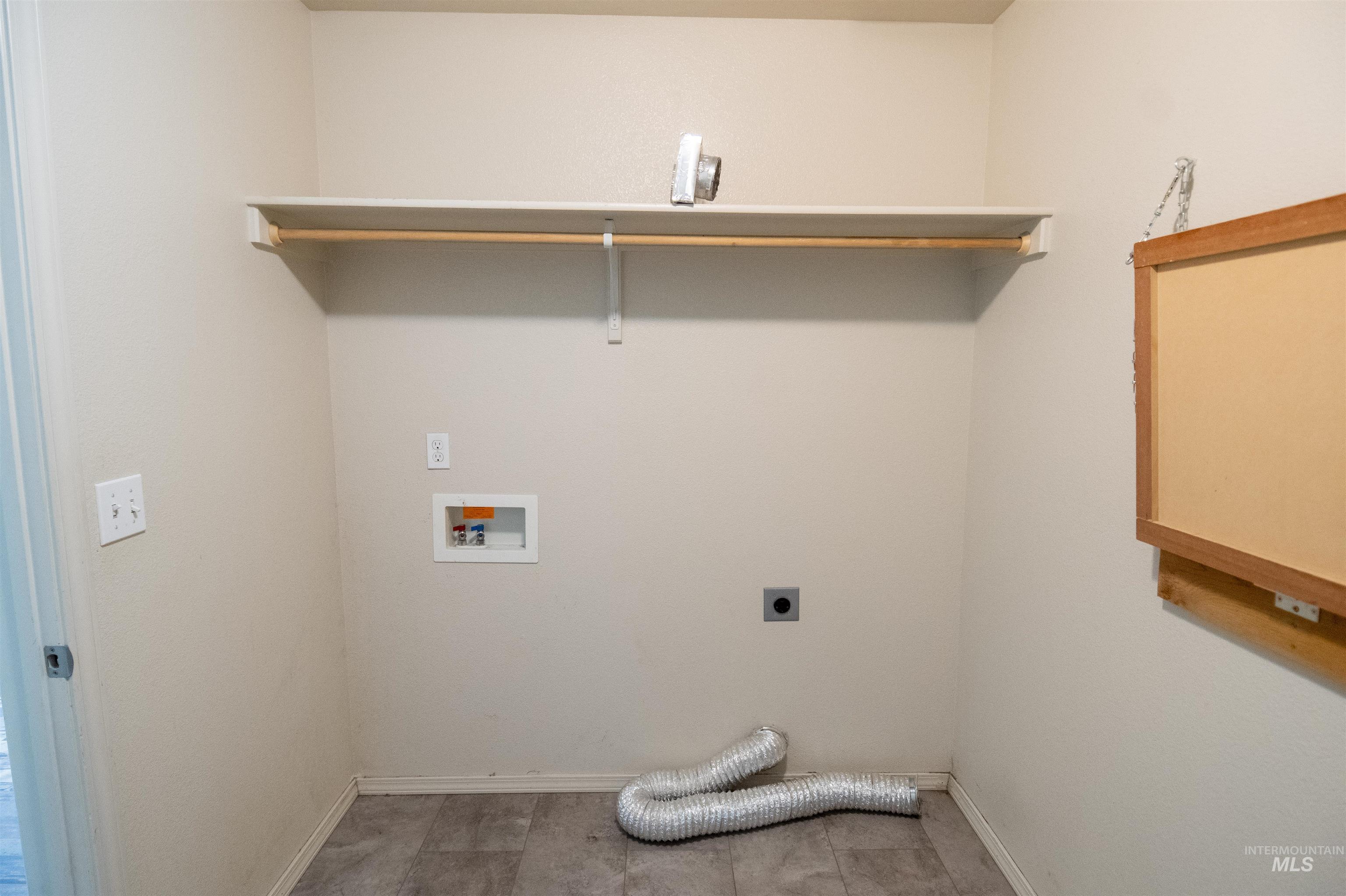 880 Southwest Independence Mountain Home, ID 83647 - Photo 34 of 50 Washroom featuring electric dryer hookup and washer hookup