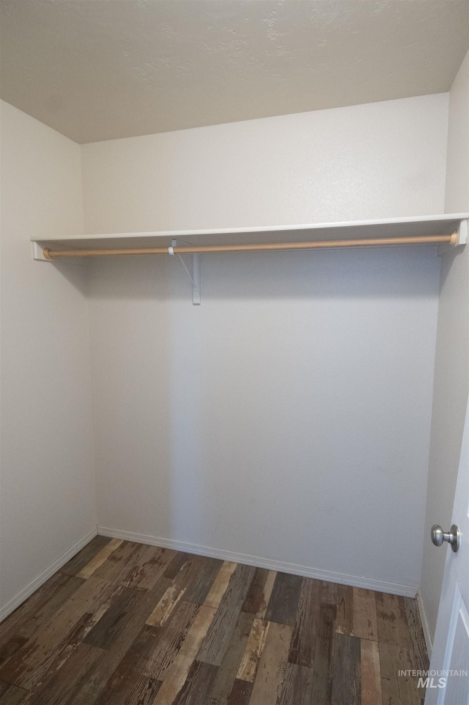 880 Southwest Independence Mountain Home, ID 83647 - Photo 35 of 50 Spacious closet featuring dark wood finished floors