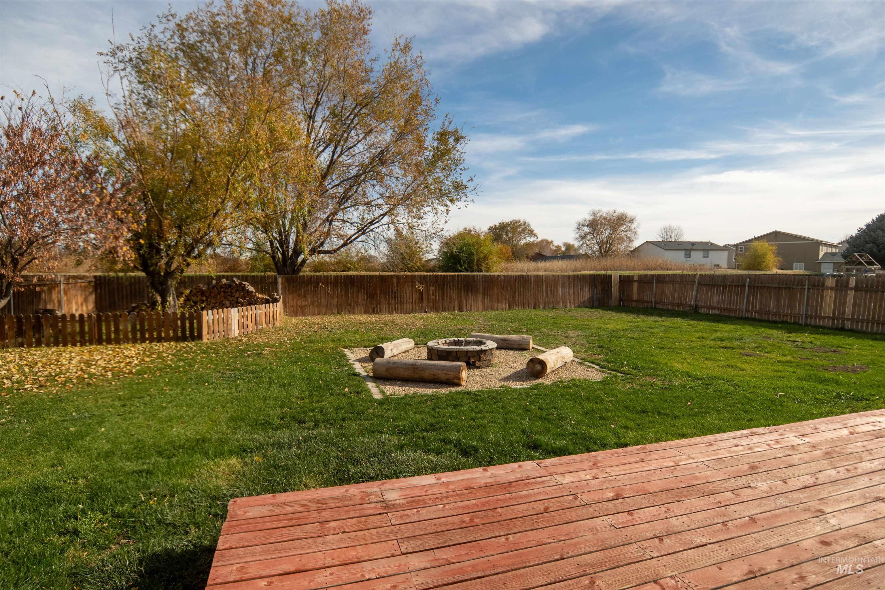 880 Southwest Independence Mountain Home, ID 83647 - Photo 45 of 50 Fenced backyard with a fire pit