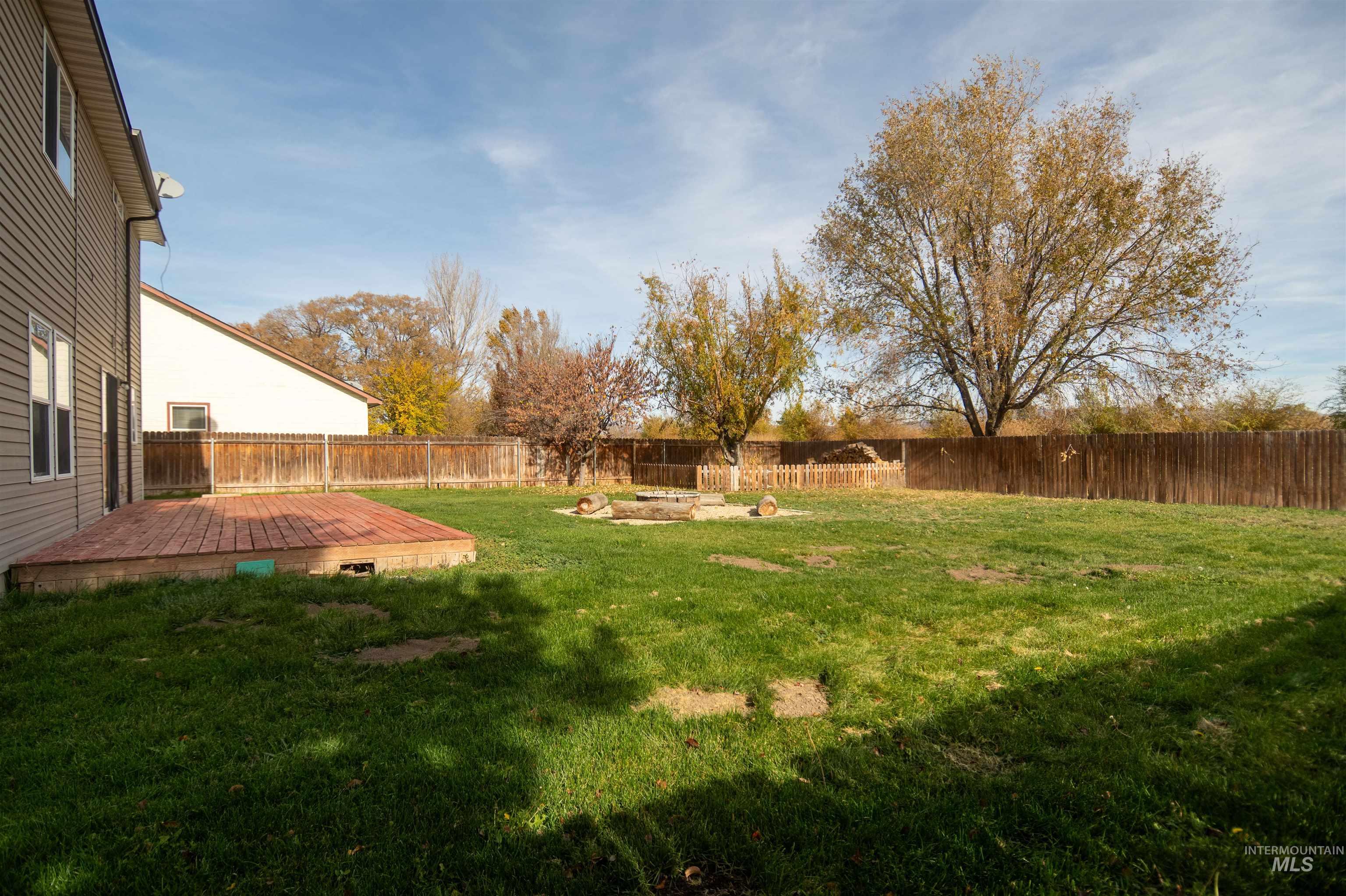 880 Southwest Independence Mountain Home, ID 83647 - Photo 47 of 50 Fenced backyard featuring a deck