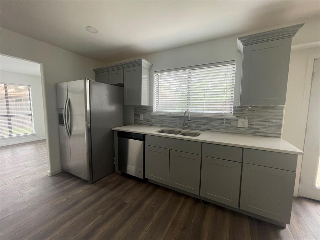 3 Ridge Drive Hickory Creek, TX 75065 - Photo 10 of 20 a kitchen with stainless steel appliances granite countertop a refrigerator and a sink