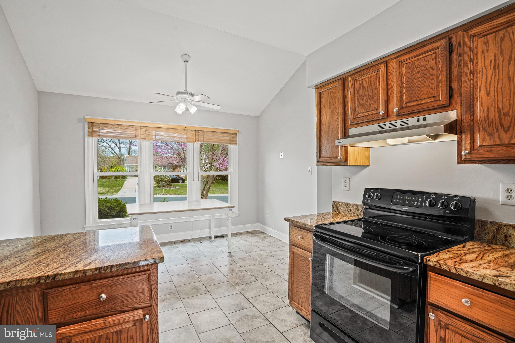2913 Gracefield Road Silver Spring, MD 20904 - Photo 14 of 53 a kitchen with granite countertop a stove and a sink