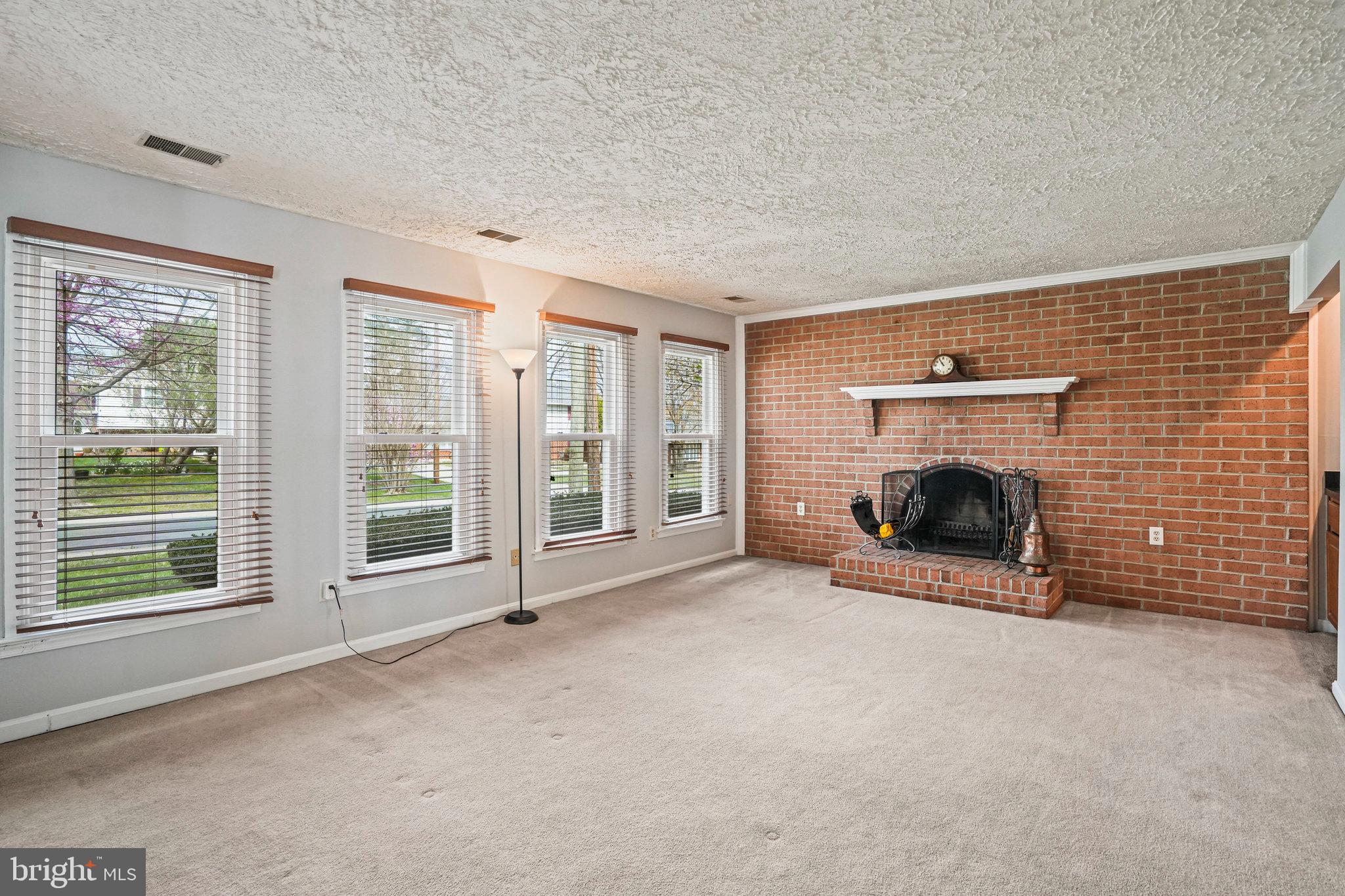 2913 Gracefield Road Silver Spring, MD 20904 - Photo 20 of 53 a view of an empty room with a fireplace and a window