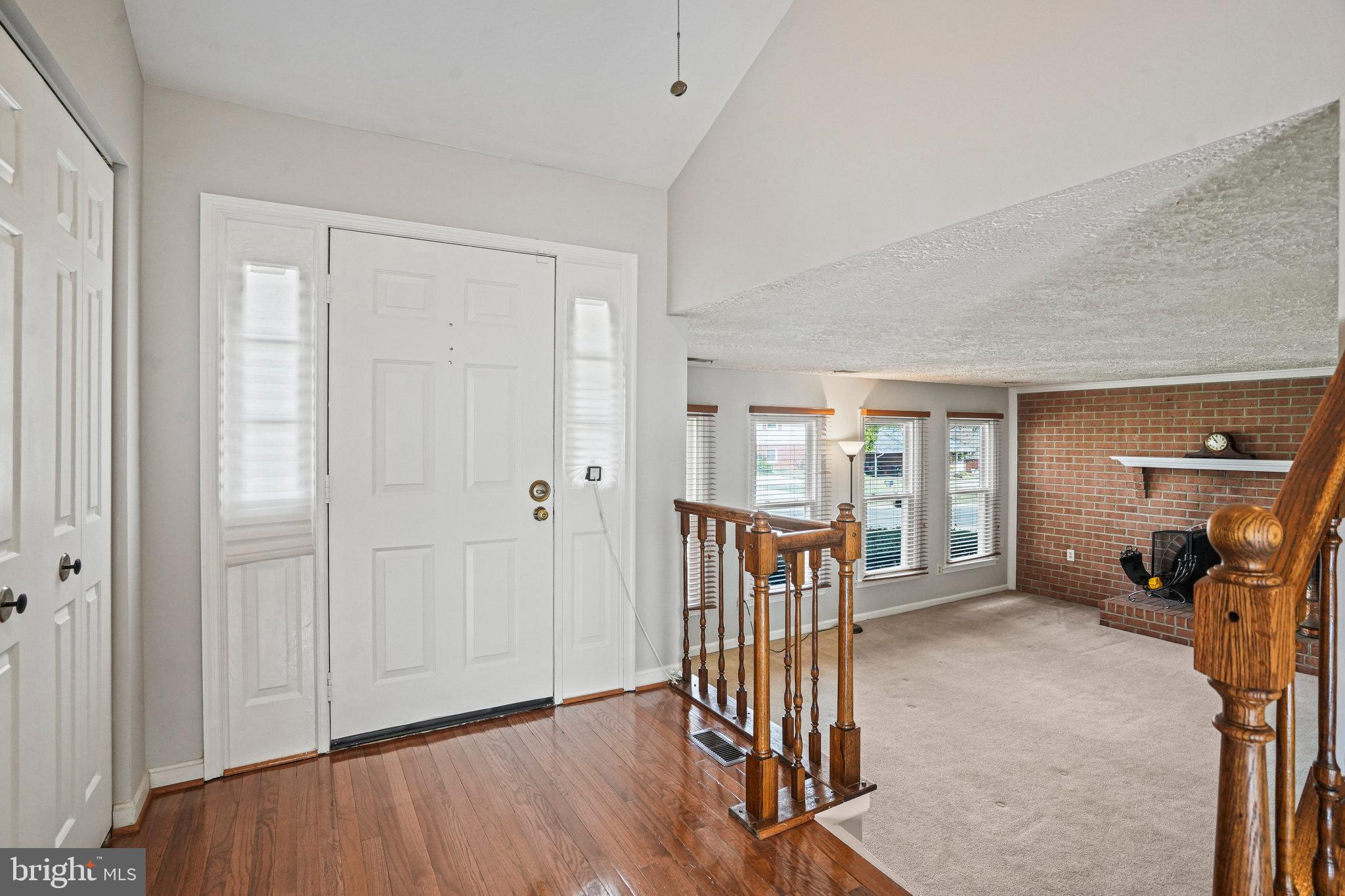 2913 Gracefield Road Silver Spring, MD 20904 - Photo 4 of 53 a view of a hallway with wooden floor and windows