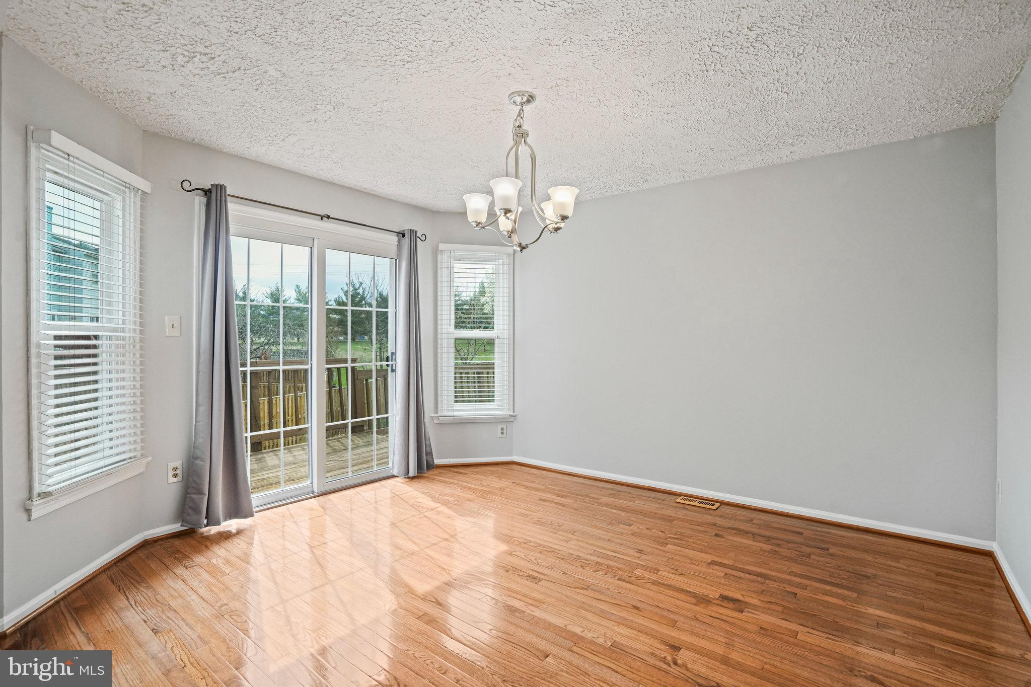 2913 Gracefield Road Silver Spring, MD 20904 - Photo 10 of 53 a view of a livingroom with wooden floor and a large window